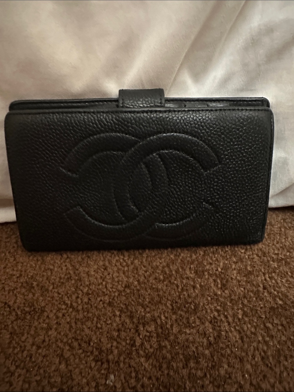 CHANEL Black Quilted CC Caviar Leather wallet.